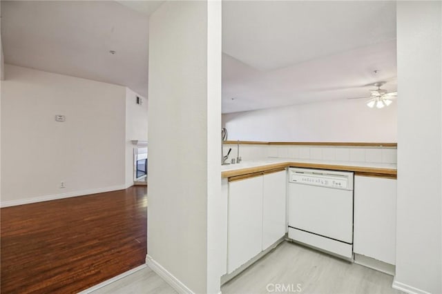 kitchen with white cabinetry, dishwasher, sink, ceiling fan, and light wood-type flooring