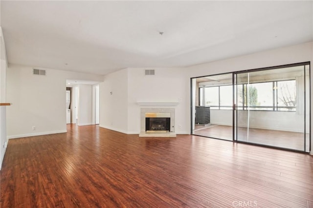 unfurnished living room with hardwood / wood-style flooring