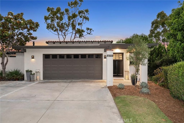 view of front of home with a garage