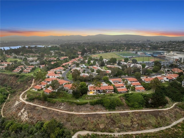 aerial view at dusk with a mountain view