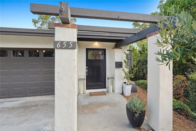 entrance to property featuring a garage