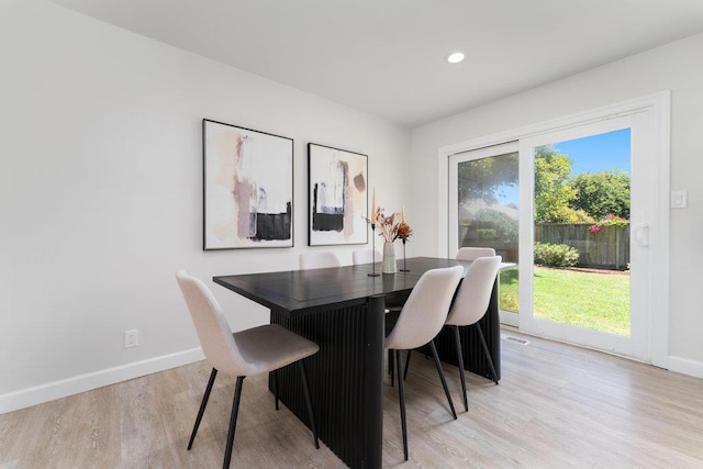 dining room featuring light hardwood / wood-style flooring