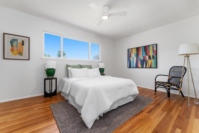 bedroom featuring ceiling fan and wood-type flooring