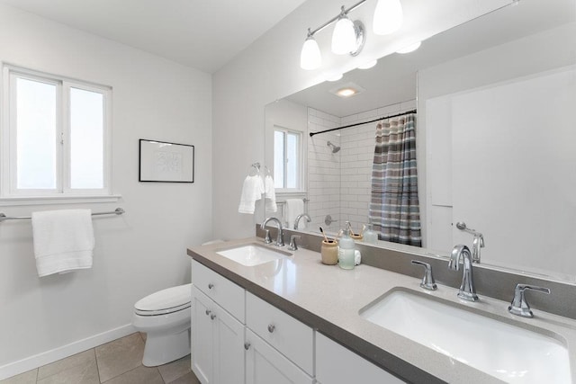 bathroom featuring vanity, curtained shower, tile patterned floors, and toilet