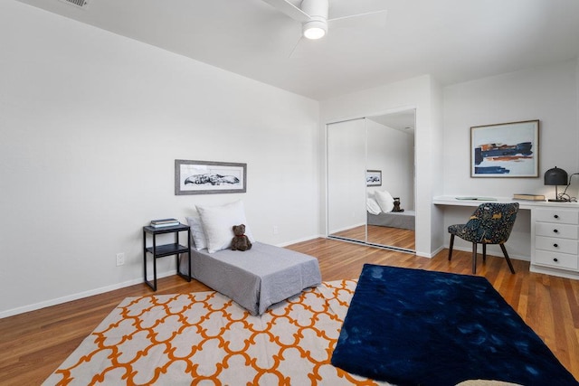 living area featuring ceiling fan and wood-type flooring