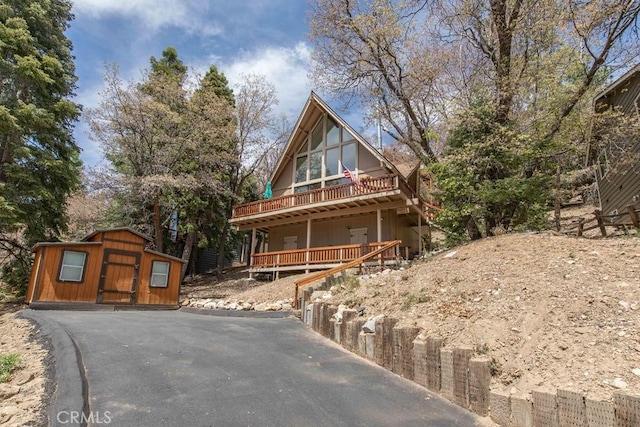 log cabin featuring a storage unit