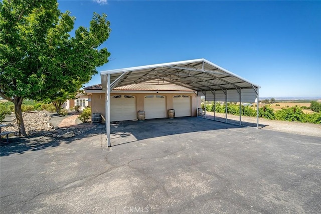 view of parking with a garage and a carport