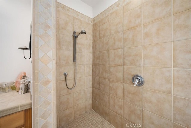 bathroom with a tile shower