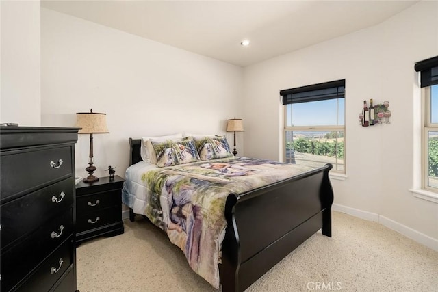 bedroom with recessed lighting and baseboards