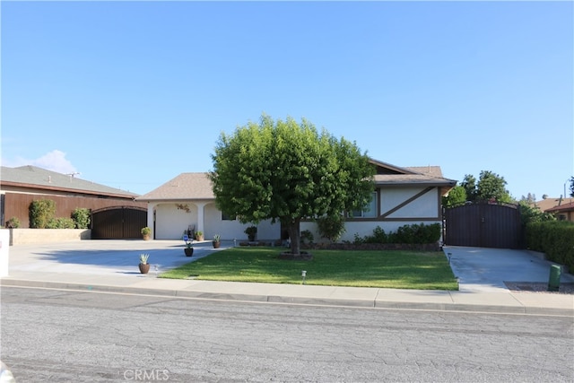 single story home featuring a front yard and a garage