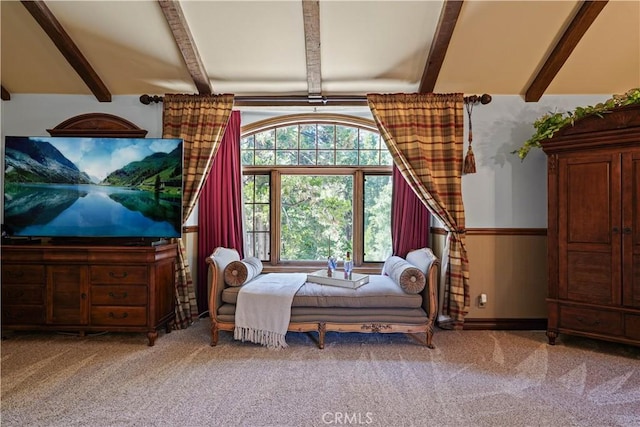 carpeted bedroom featuring vaulted ceiling with beams