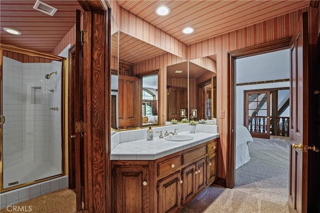 bathroom featuring vanity, wooden ceiling, and walk in shower