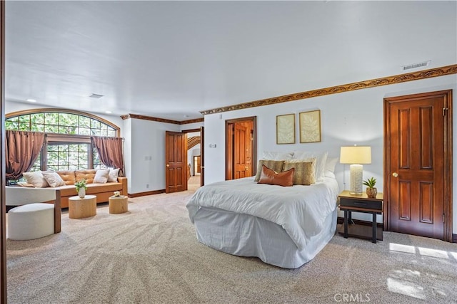 bedroom featuring carpet flooring and crown molding