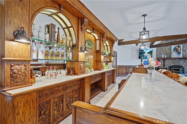 bar with a fireplace and wooden walls