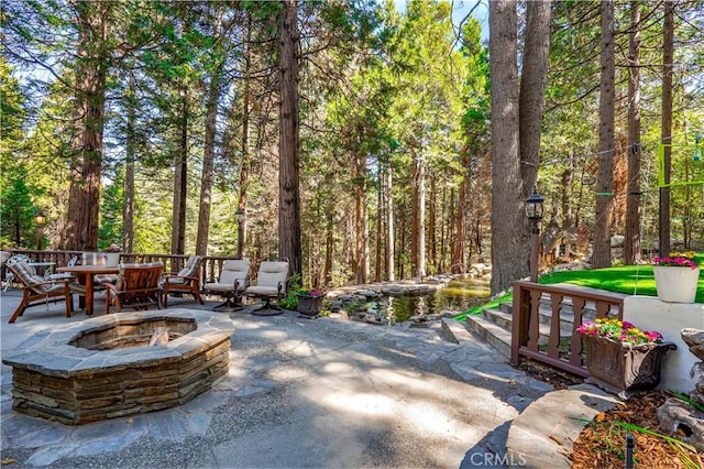 view of patio with an outdoor fire pit