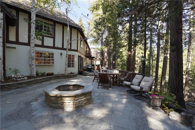 view of patio / terrace featuring a fire pit