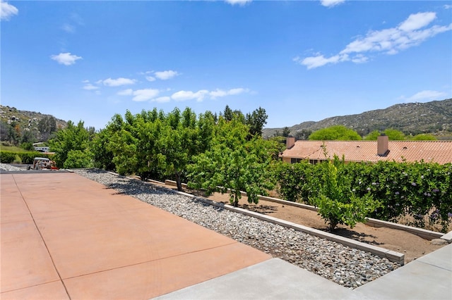 view of patio / terrace with a mountain view