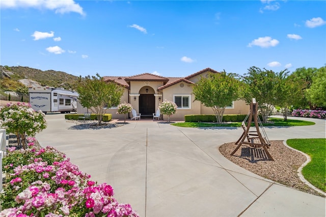 mediterranean / spanish home with a mountain view