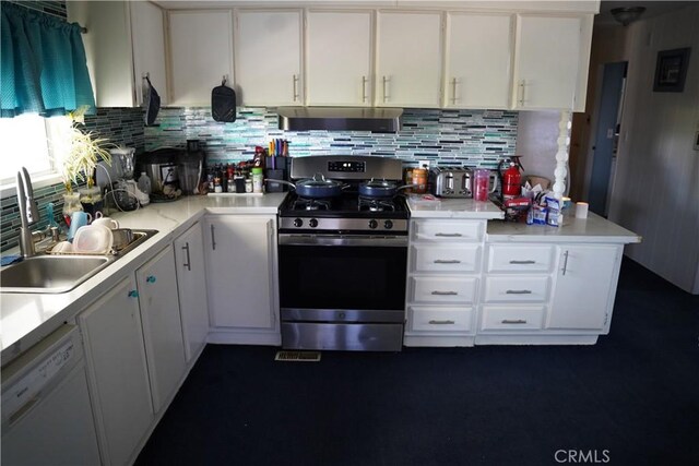 kitchen with sink, white cabinets, decorative backsplash, white dishwasher, and stainless steel range