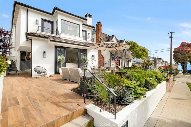 exterior space with a balcony and a patio