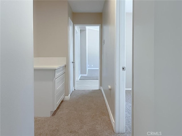 hallway with light carpet