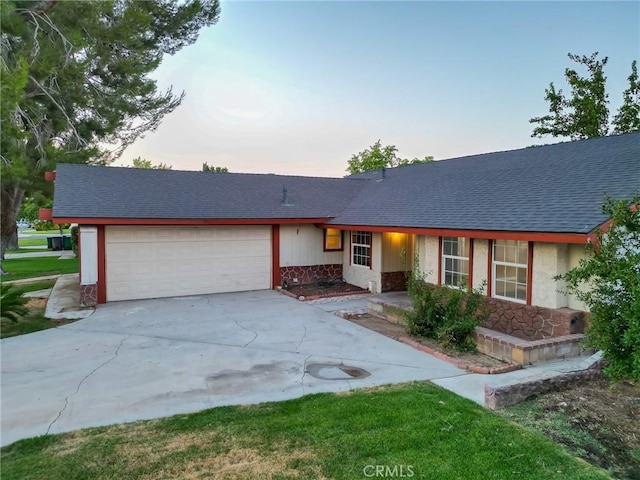 ranch-style home featuring a garage