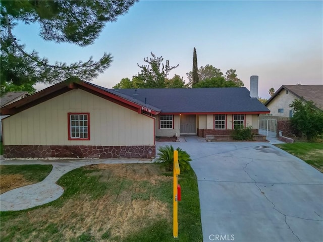 ranch-style house with a yard