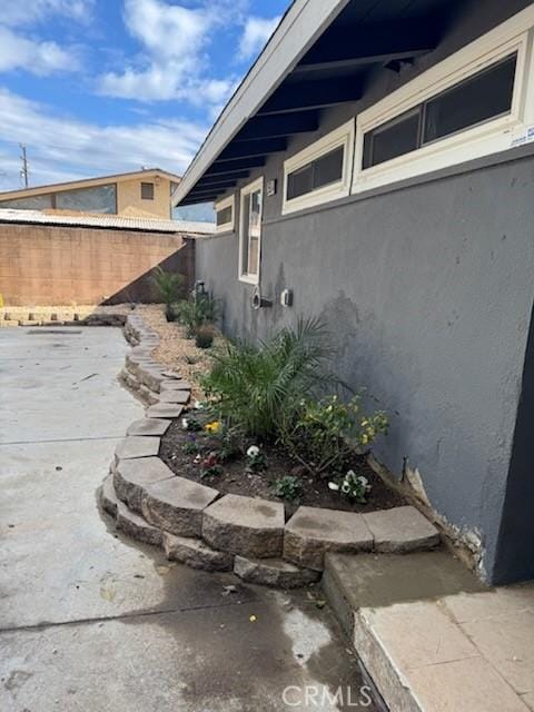 view of property exterior featuring a patio area