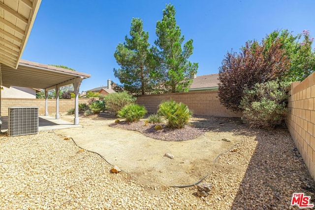 view of yard with a patio area and central AC