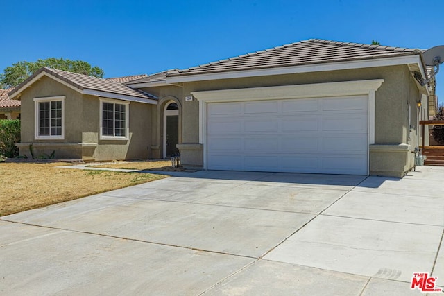 ranch-style house featuring a garage