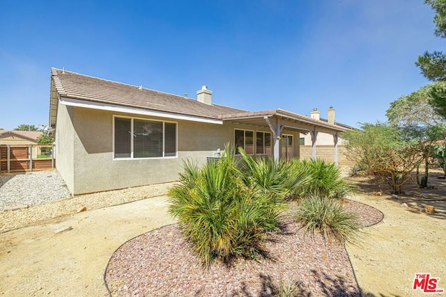 rear view of house with a patio