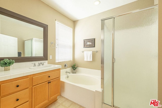 bathroom with vanity and plus walk in shower