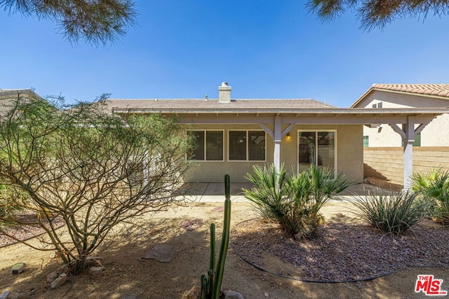 rear view of house featuring a patio area