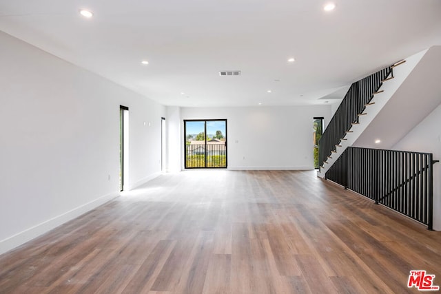 unfurnished room featuring wood-type flooring