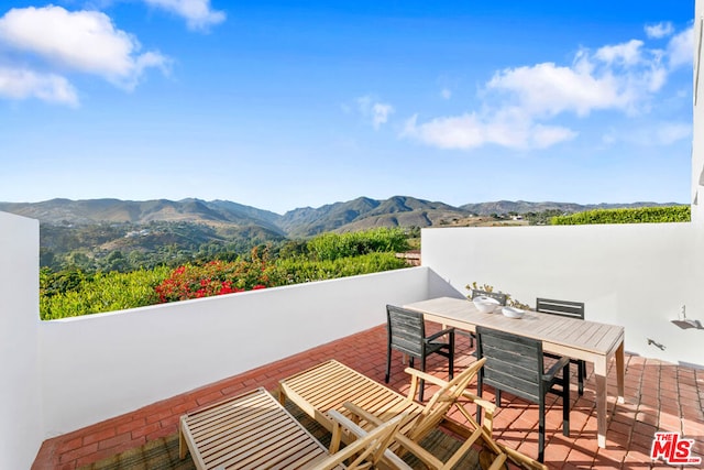 view of patio / terrace with a mountain view