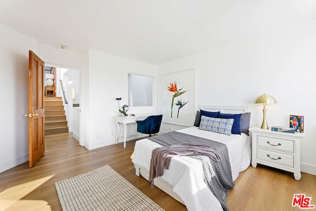 bedroom featuring light wood-type flooring