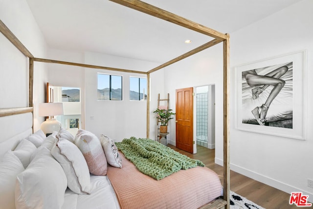 bedroom featuring hardwood / wood-style flooring