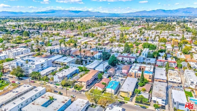 birds eye view of property with a mountain view