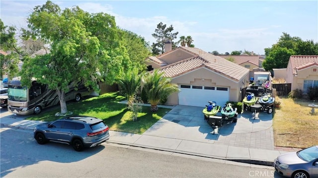 view of front facade with a garage and a front yard