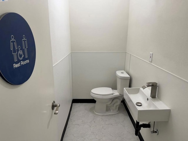 bathroom with toilet and sink