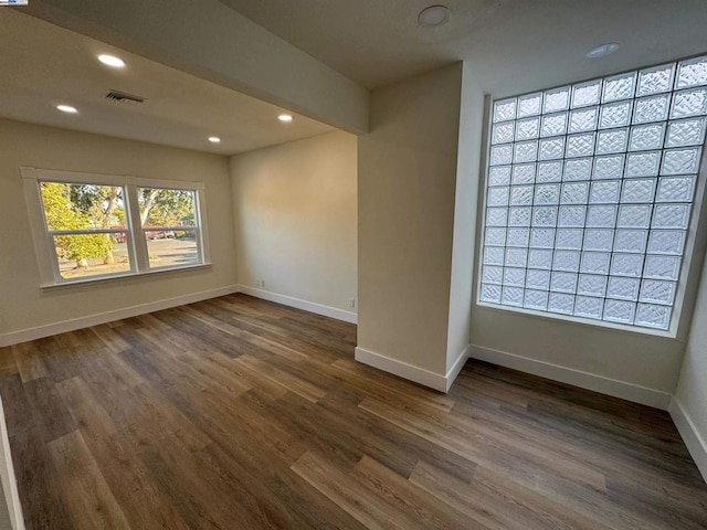 spare room featuring dark hardwood / wood-style floors