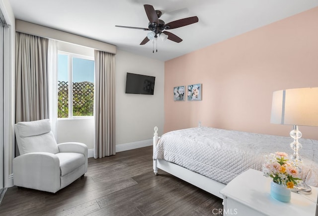 bedroom with dark wood-type flooring and ceiling fan