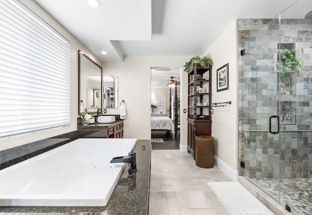 bathroom featuring vanity, shower with separate bathtub, and ceiling fan