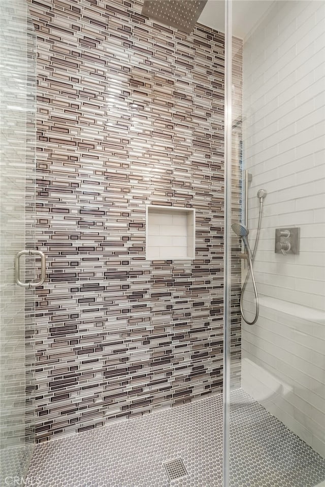 bathroom featuring an enclosed shower