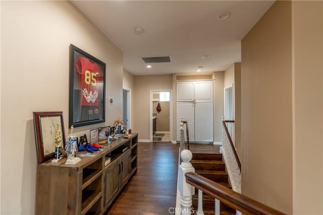 corridor featuring dark hardwood / wood-style flooring