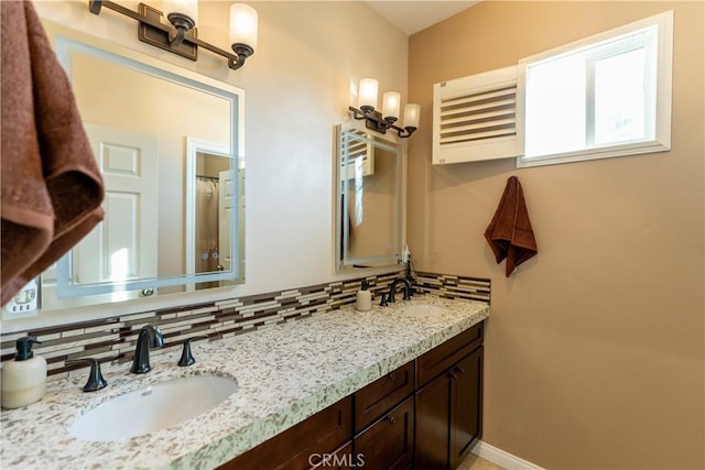 bathroom featuring decorative backsplash and vanity