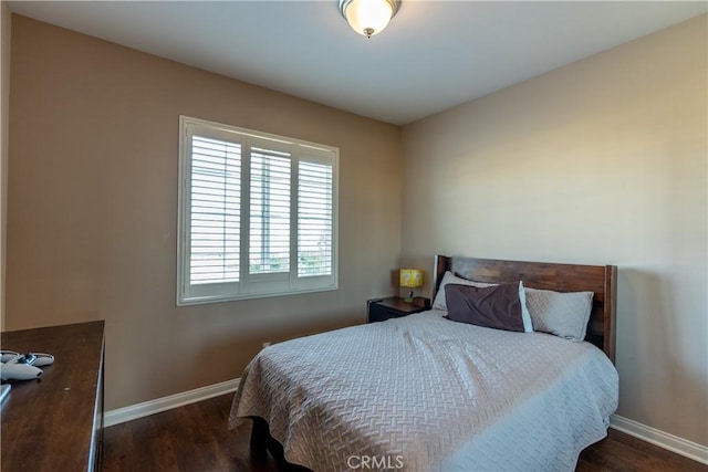 bedroom featuring dark wood-type flooring