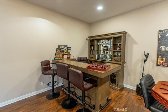 bar featuring dark hardwood / wood-style floors