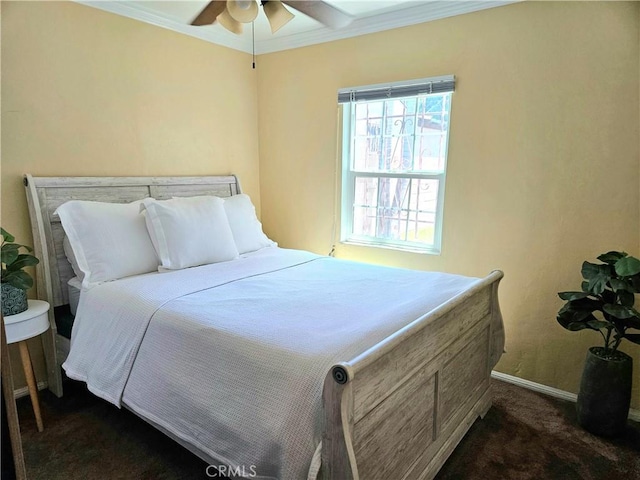 bedroom featuring dark carpet, ceiling fan, and crown molding