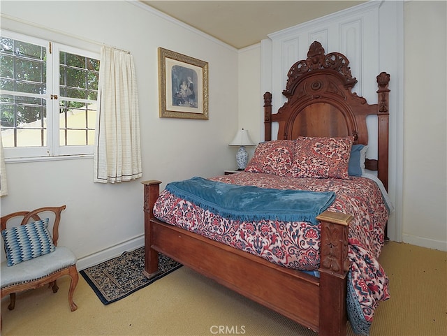 bedroom featuring crown molding, carpet, and a baseboard radiator